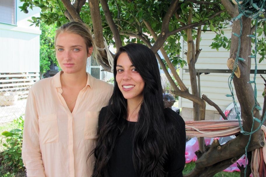 Courtney Wilson, left, and Taylor Guerrero have filed a lawsuit against the Hawaii Police Department, claiming they were arrested after an officer took issue with them kissing in public