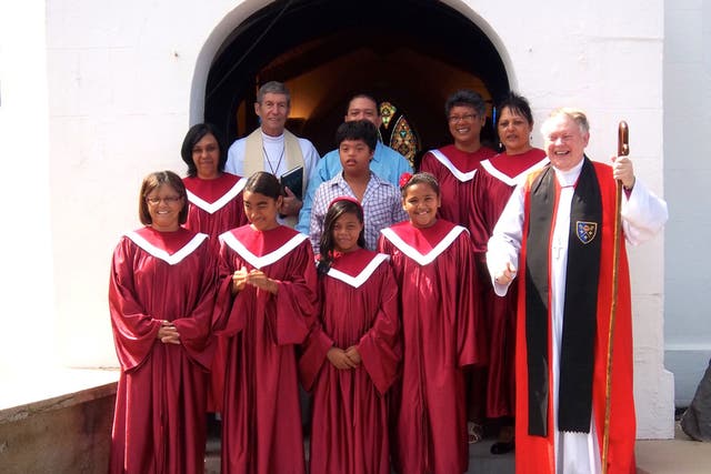 Rt Rev Dr Richard Fenwick, right, with the choir