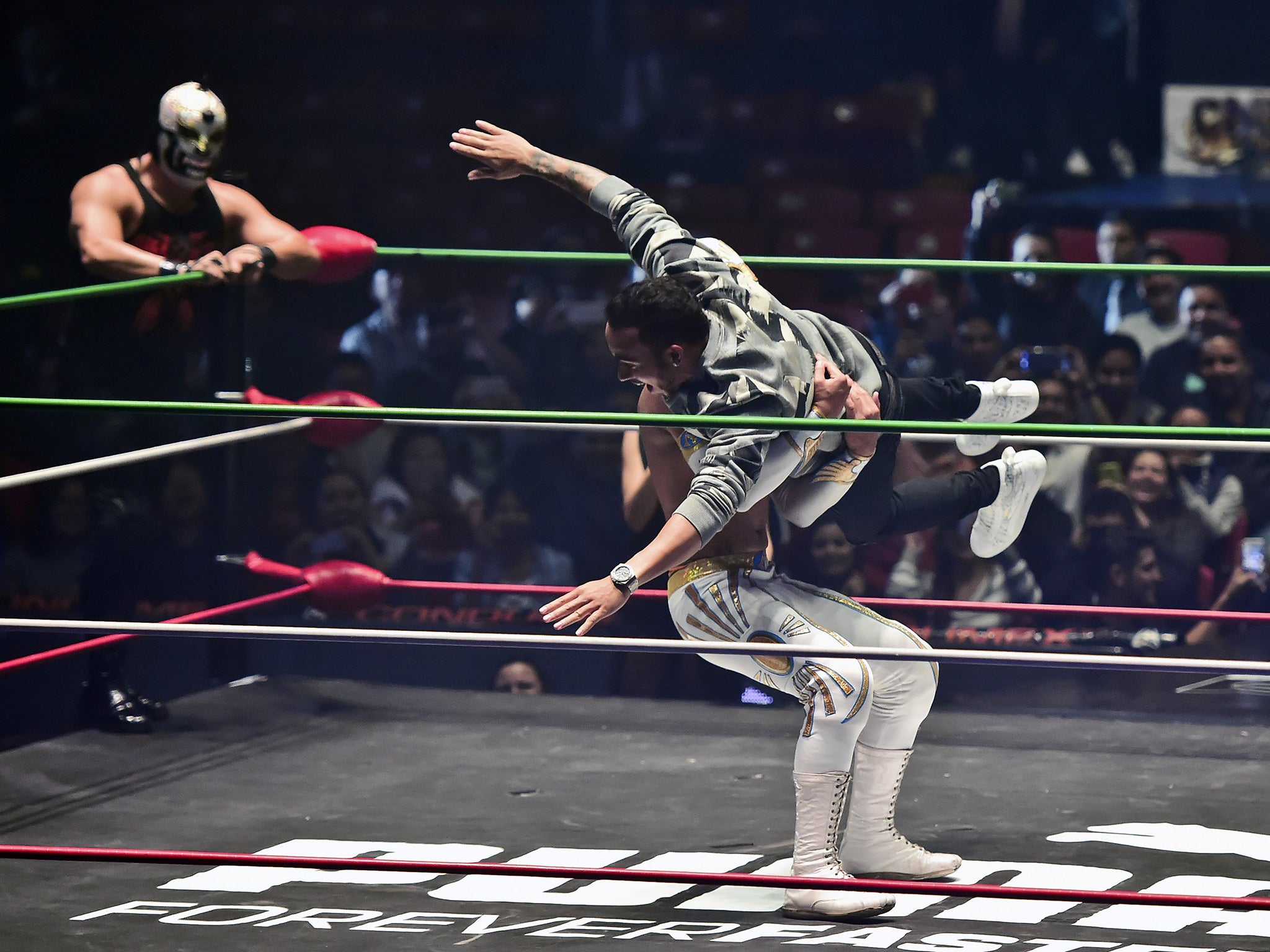 Lewis Hamilton taking part in a Mexican wrestling match