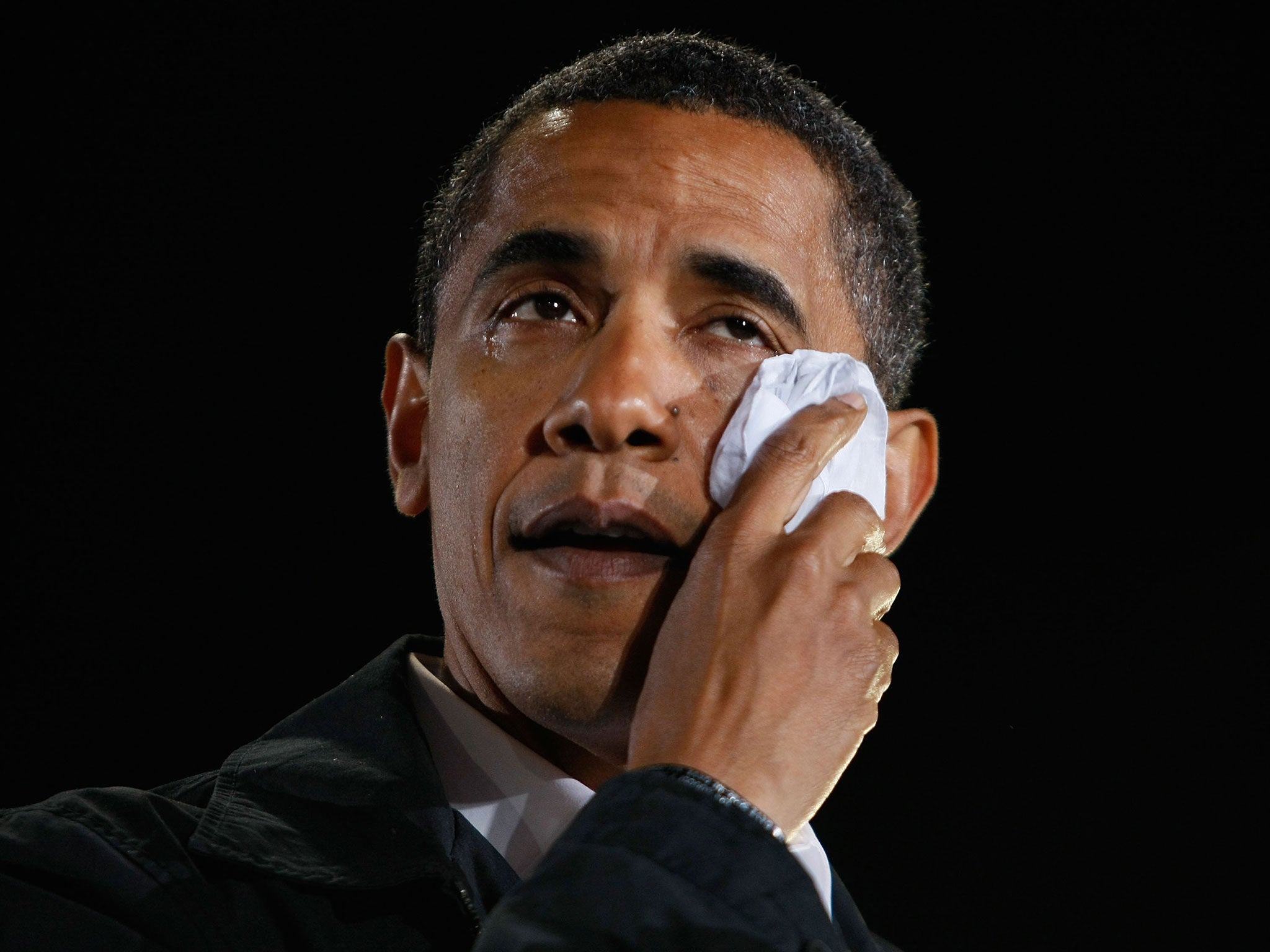 Barack Obama wipes away tears as he cries while speaking about his grandmother during a rally at University of North Carolina on November 3, 2008