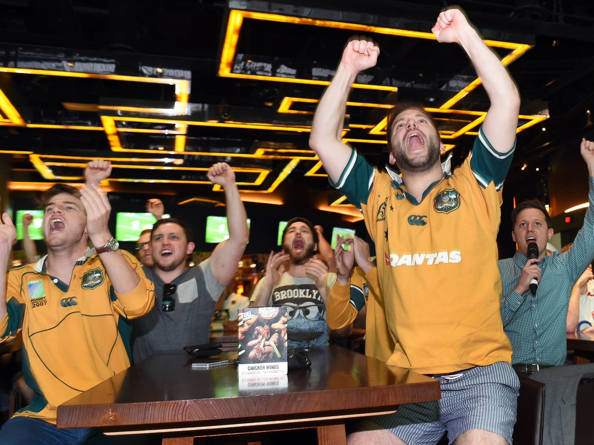 Australian fans cheer as their team knocks England out of the World Cup