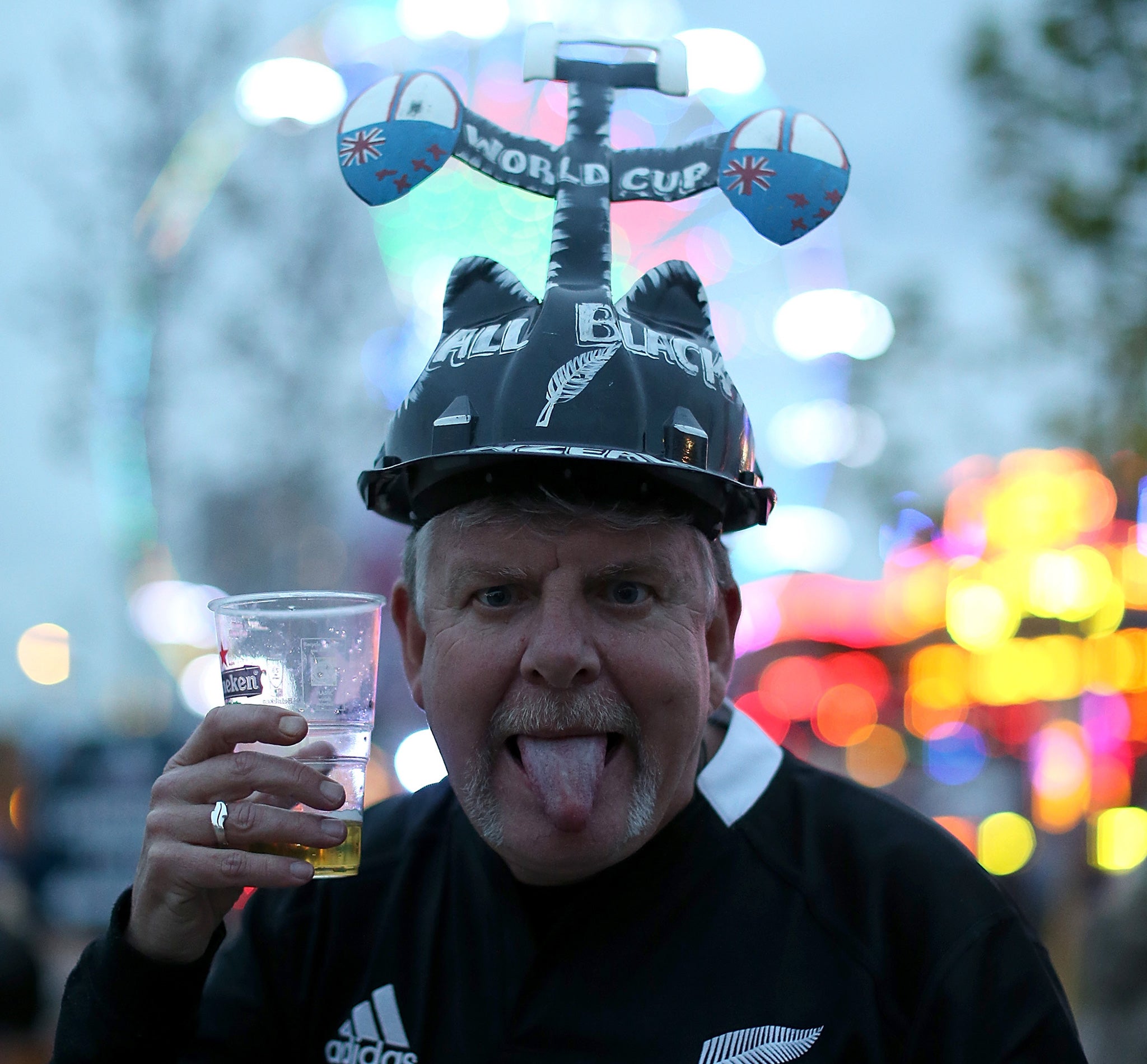 A fan poses ahead of The All Black's game against Tonga