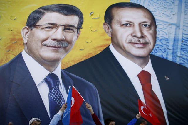 Recep Tayyip Erdogan, right, and Prime Minister Ahmet Davutoglu on a campaign banner