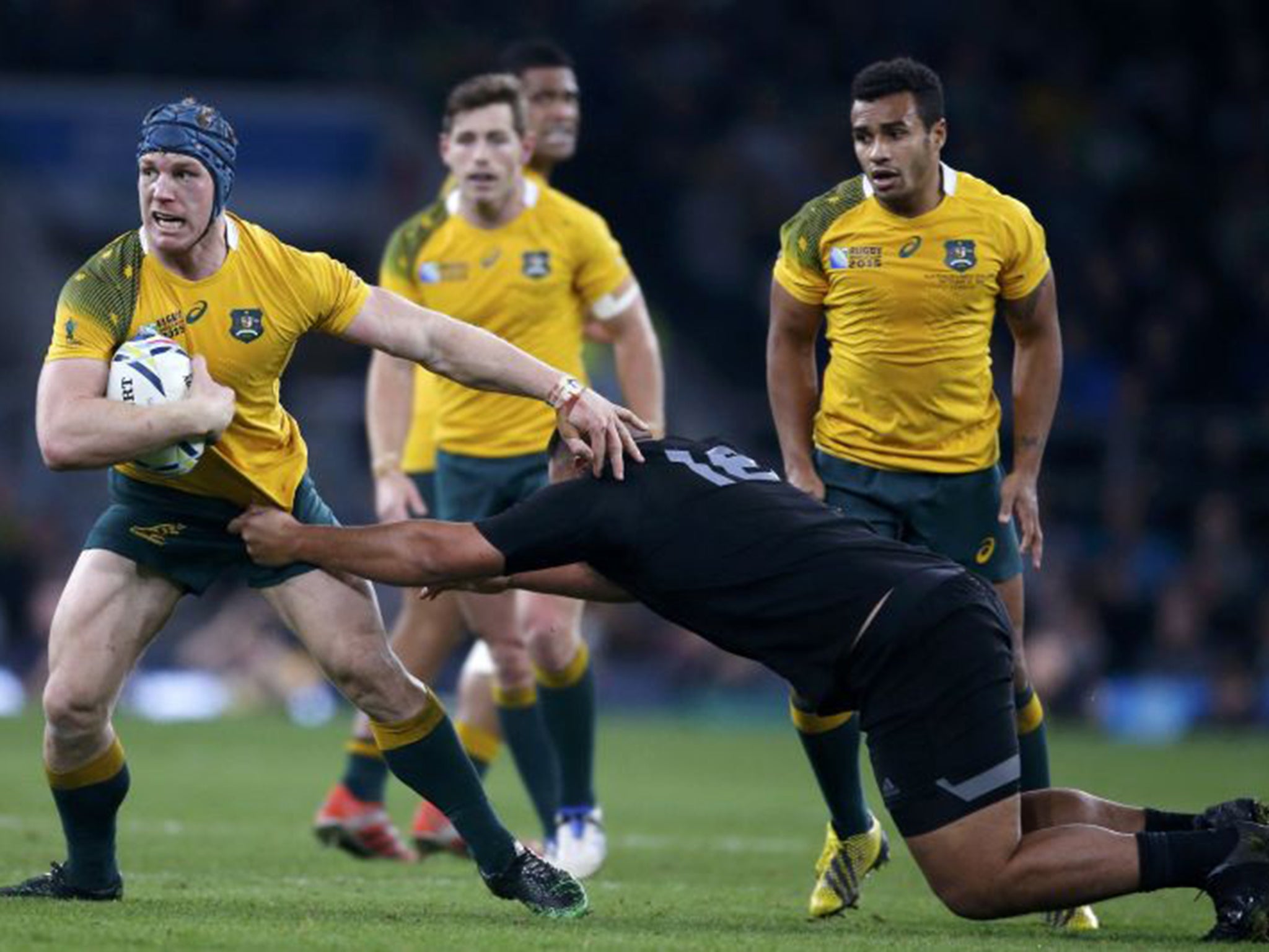 David Pocock, left, holds off Keven Mealamu