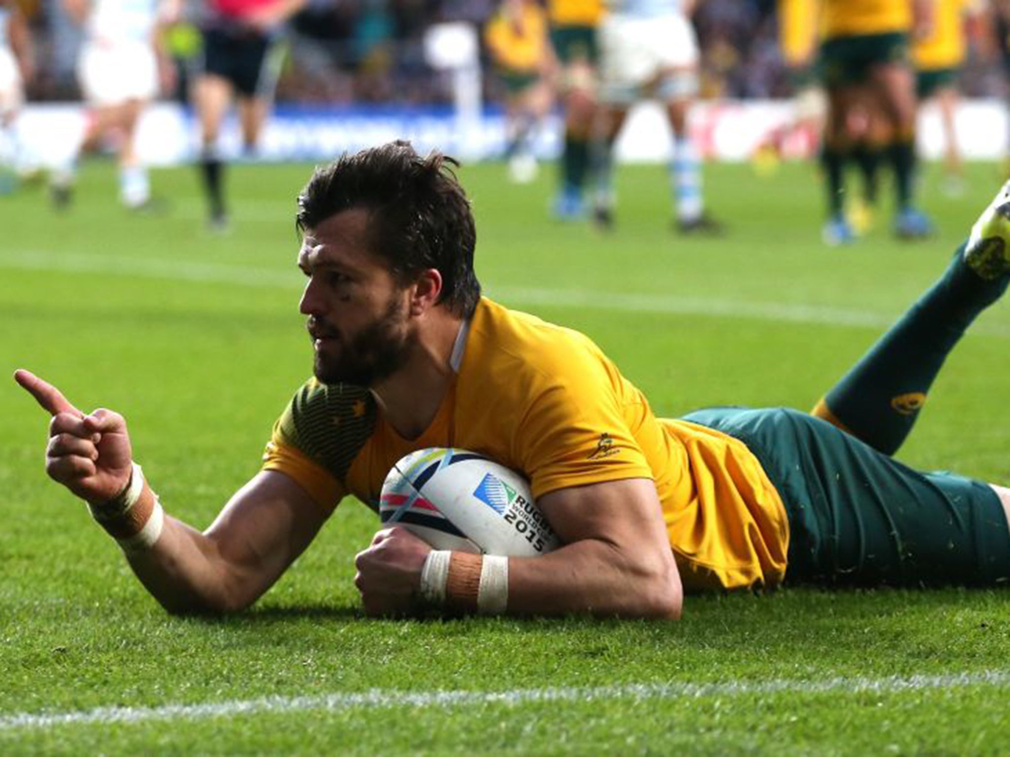 Adam Ashley-Cooper celebrates the Australia try made by Bernard Foley’s pass