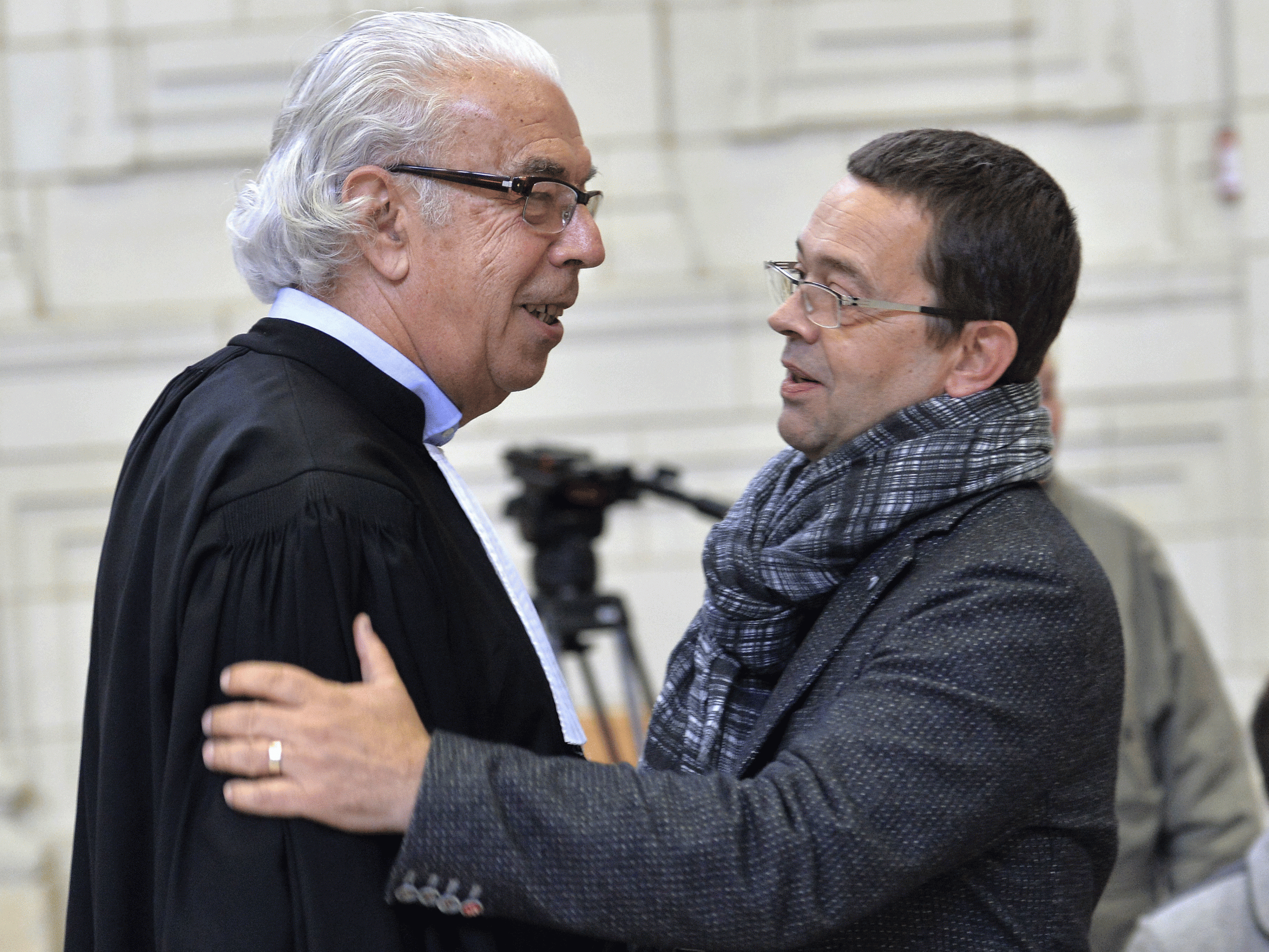 Nicolas Bonnemaison (right) speaks with one of his lawyers at Angers' courthouse on October 23