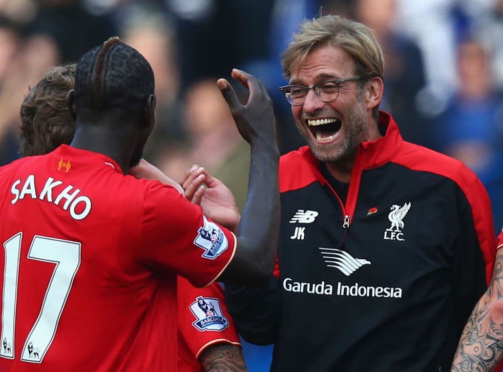Liverpool manager Jurgen Klopp celebrates with his players after victory over Chelsea