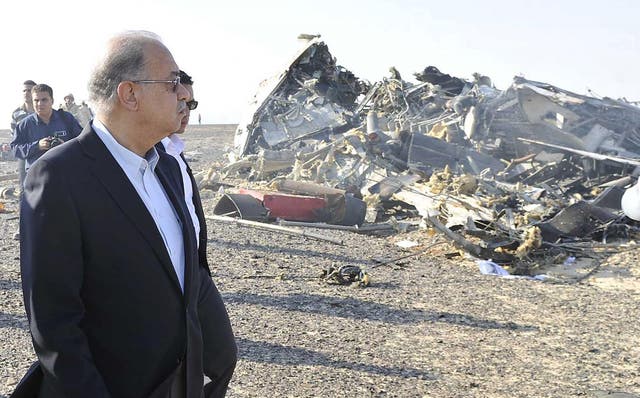 Egypt's Prime Minister Sherif Ismail looks the crash site