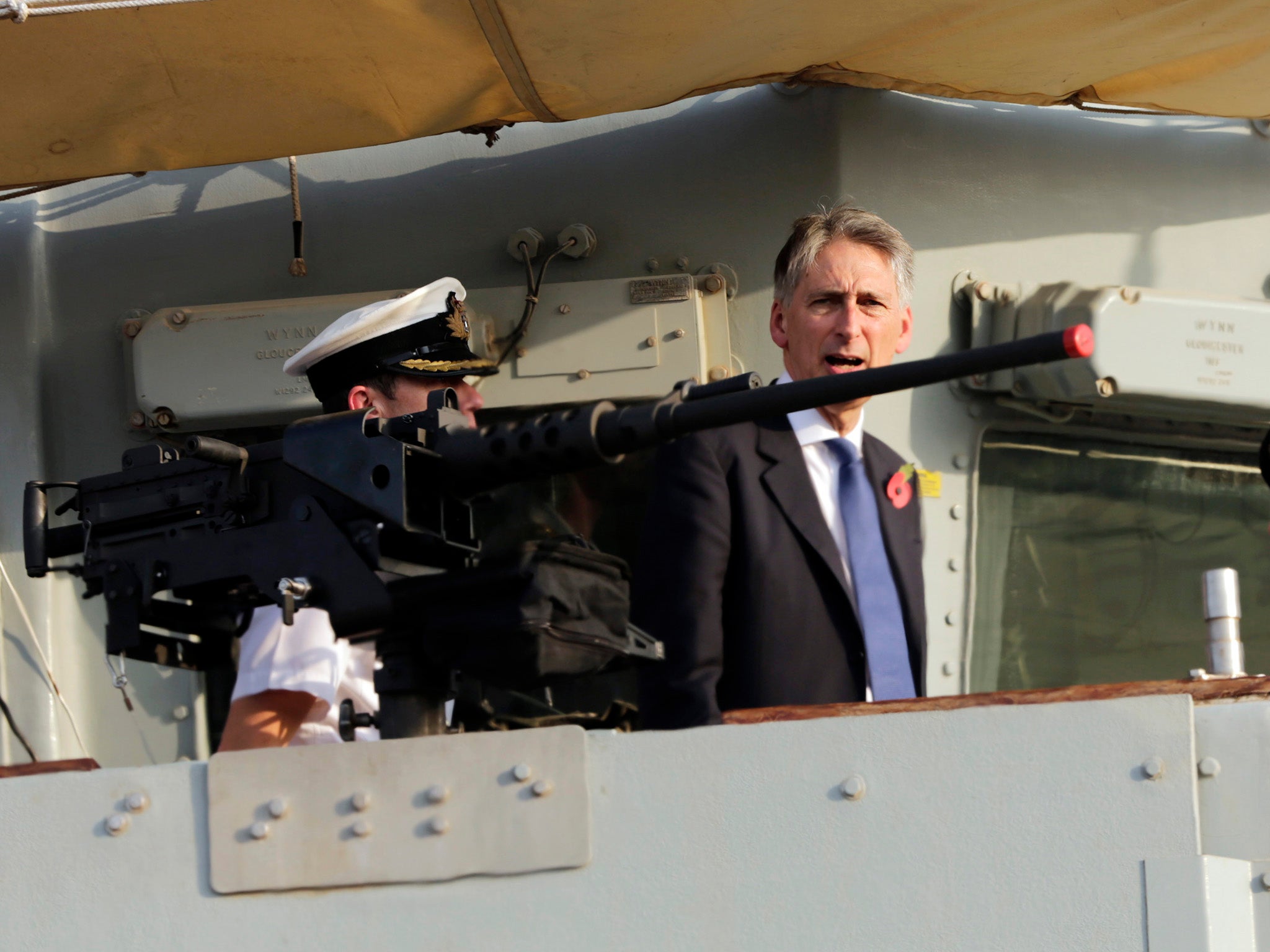 British Foreign Secretary Philip Hammond boards a British military ship docked in Manama, Bahrain after helping lay a cornerstone for a new British military base being built in Bahrain.