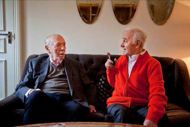 Charles Aznavour (red top) and Herbert Kretzmer, both in their 90s, meet at a London hotel.