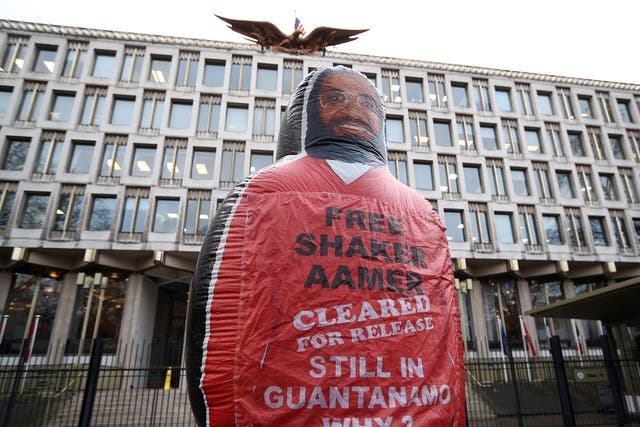 A giant inflatable figure of Shaker Aamer, the last Briton to be detained in Guantanamo Bay, is pictured during a protest by the We Stand With Shaker campaign group outside the U.S embassy in London, England.