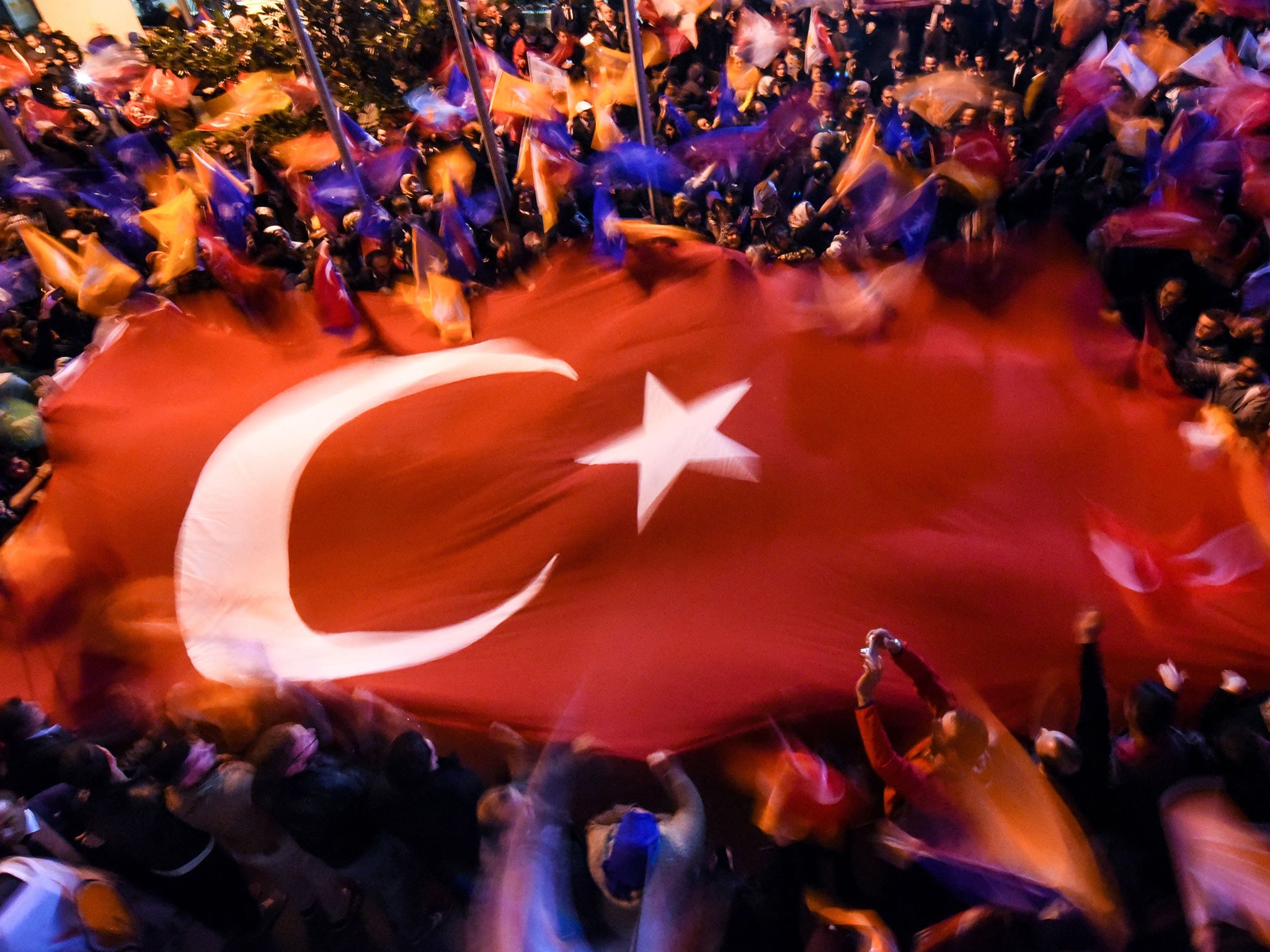 Supporters of President Recep Tayyip Erdogan celebrate the AKP's victory in Istanbul