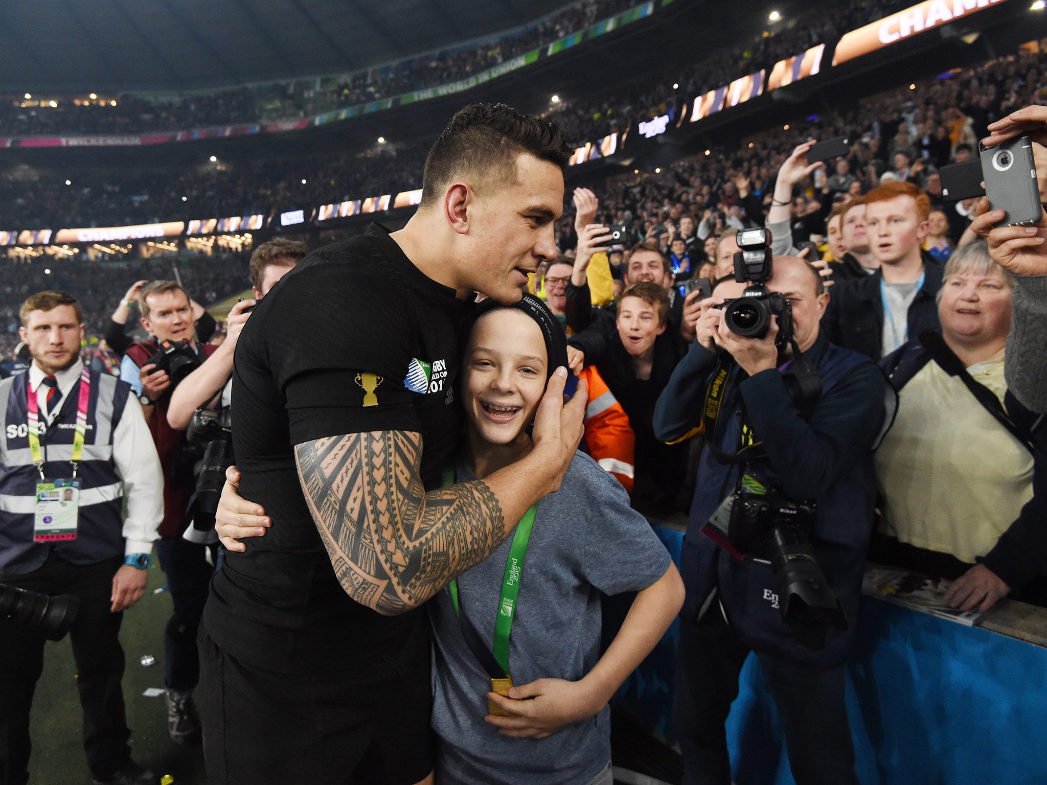 All Blacks star Sonny Bill Williams with schoolboy Charlie Lines after giving him his World Cup winner’s medal at Twickenham