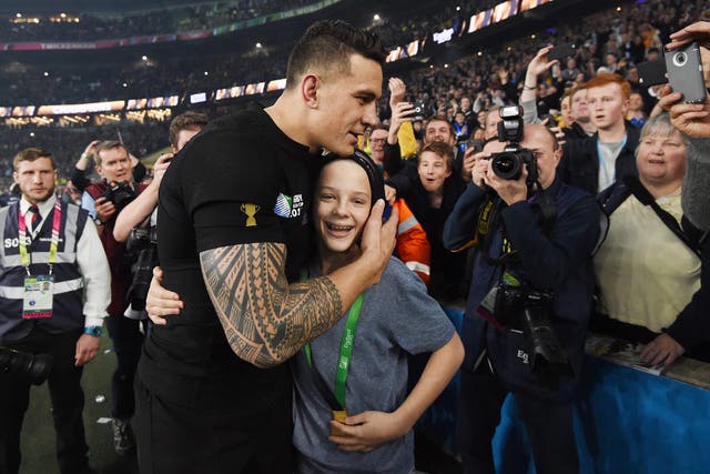 All Blacks star Sonny Bill Williams with schoolboy Charlie Lines after giving him his World Cup winner’s medal at Twickenham
