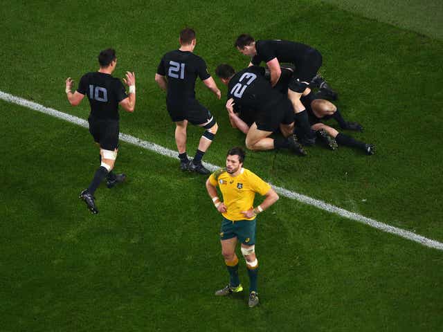 A dejected Adam Ashley-Cooper reacts after New Zealand score their third try