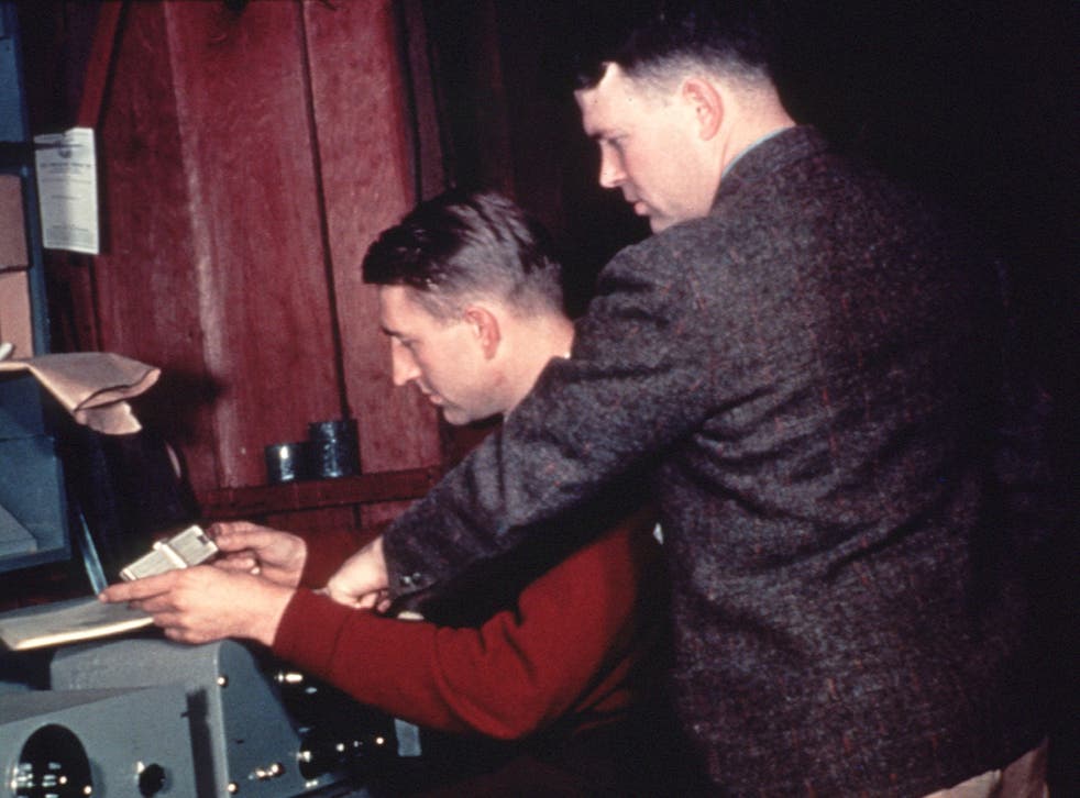 Hewlett-Packard Company co-founders David Packard (seated) and William Hewlett run final production tests on a shipment of the 200A audio oscillator. The picture was taken in 1939 in the garage at 367 Addison Avenue, Palo Alto, California, where they began their business.
