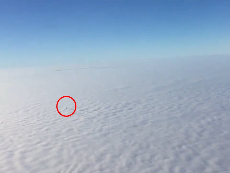 Footage shows tip of the Shard floating above a thick blanket of fog