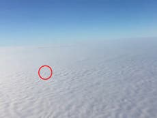 Video shot from plane shows London shrouded in fog
