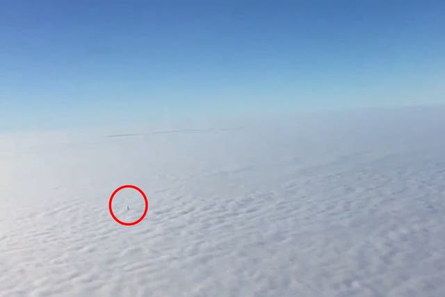 Footage shows tip of the Shard floating above a thick blanket of fog