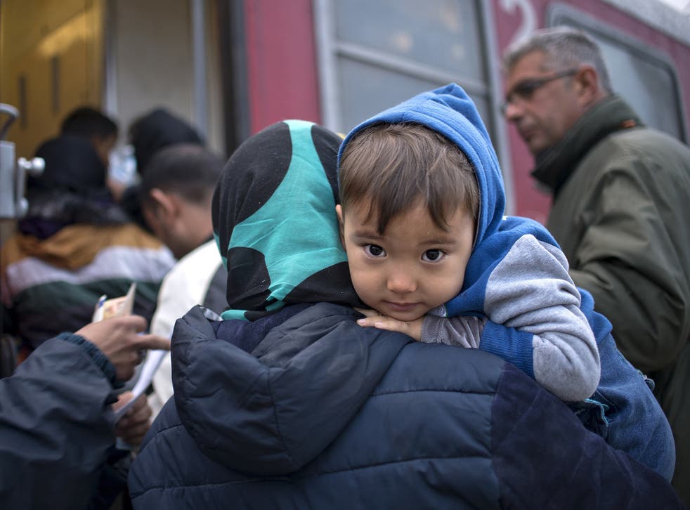 A young asylum seeker prepares to board a train heading to Serbia after crossing the Greek-Macedonian border. One in 10 of the world’s children are now growing up in a conflict zone – some 230 million children