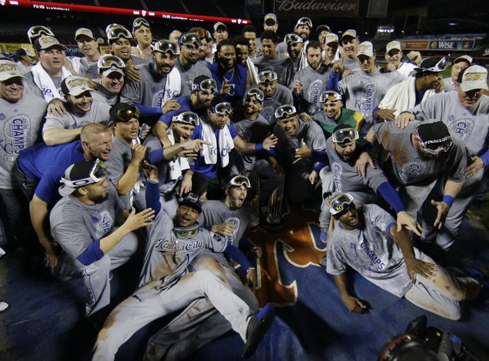 Kansas City Royals players sport ski masks as they look forward to a post-season skiboarding trip, amid the celebrations of their victory in the World Series