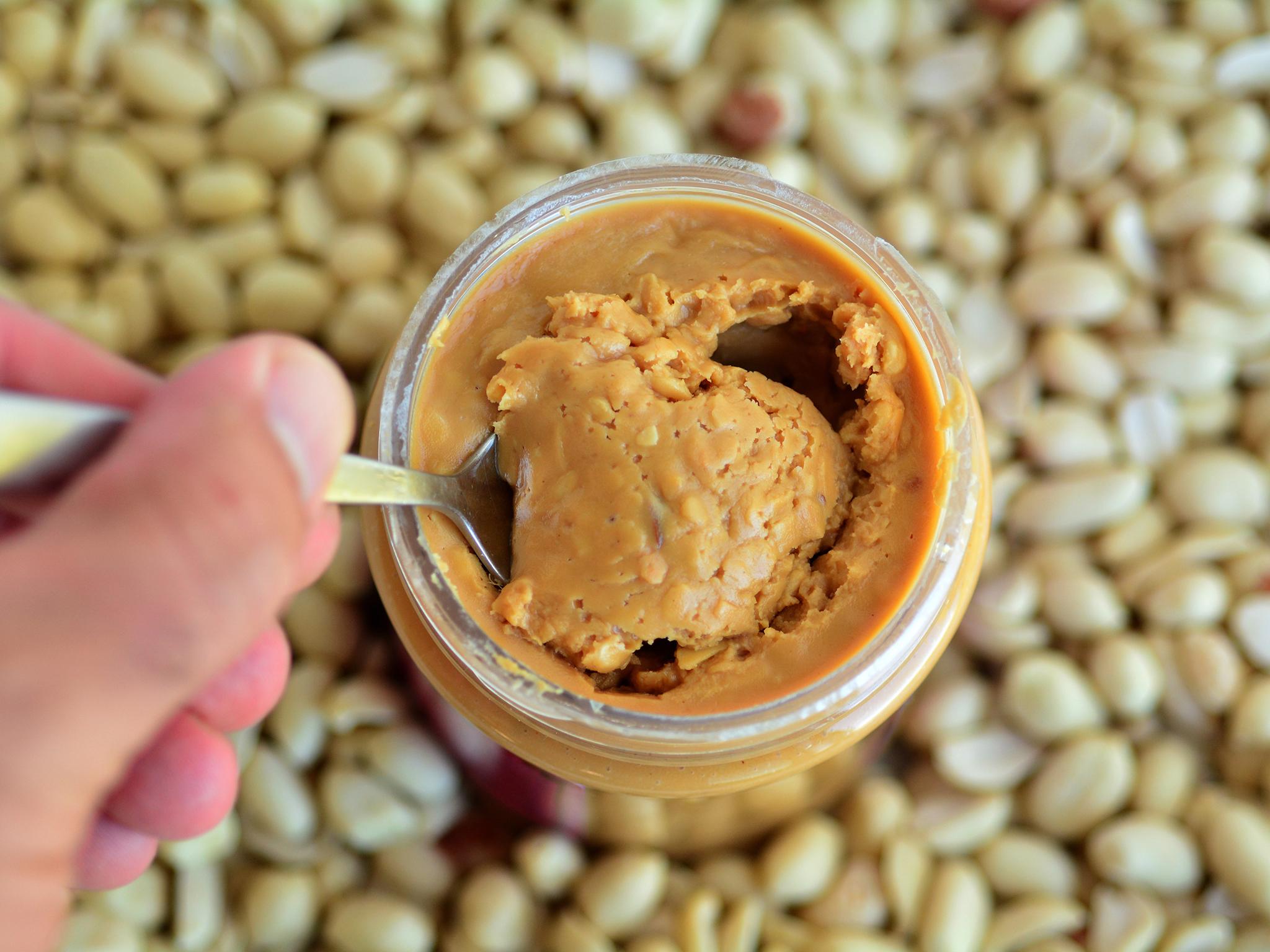 giving peanut butter to baby