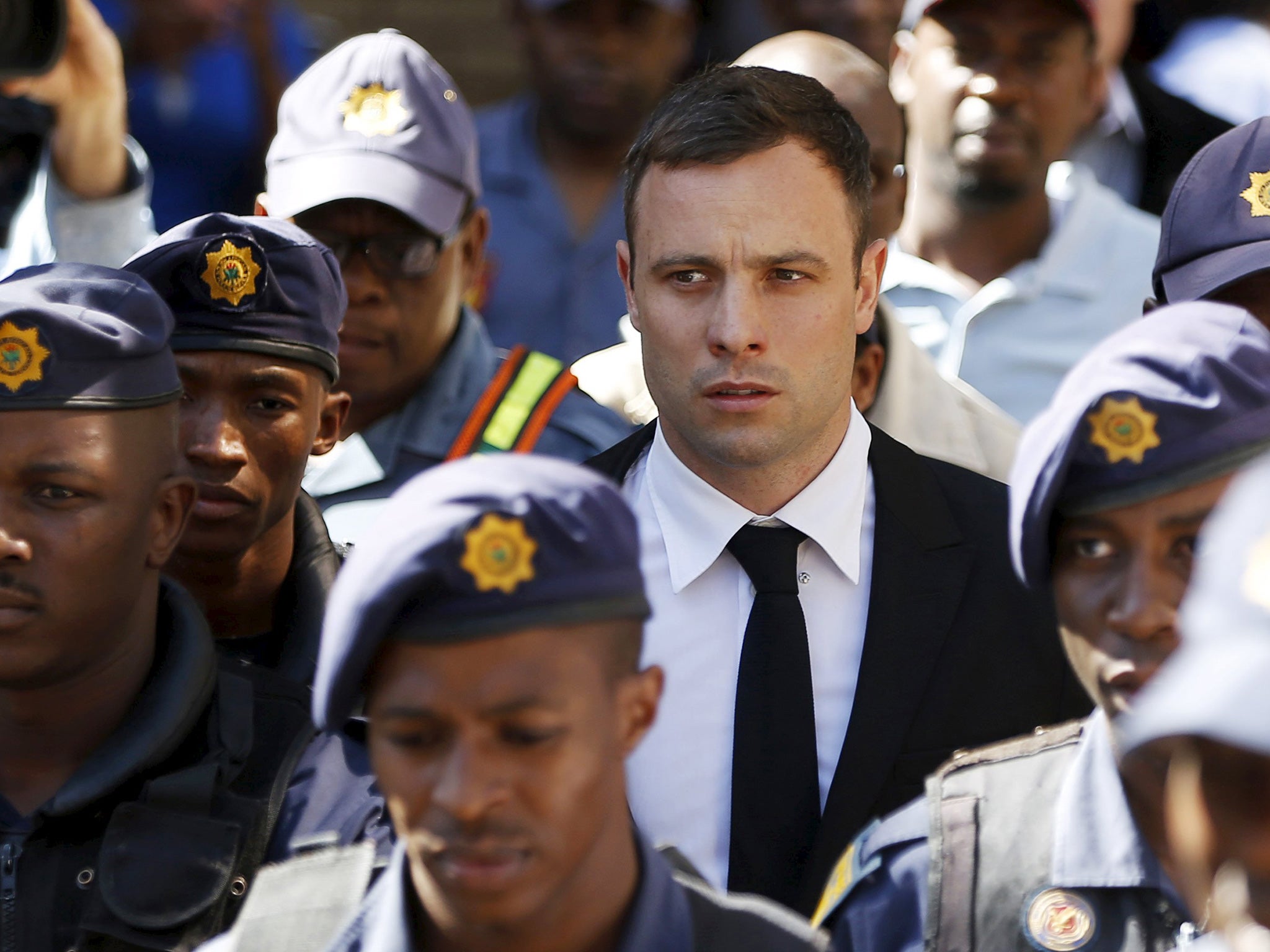 South African Olympic and Paralympic sprinter Oscar Pistorius leaves the North Gauteng High Court in Pretoria