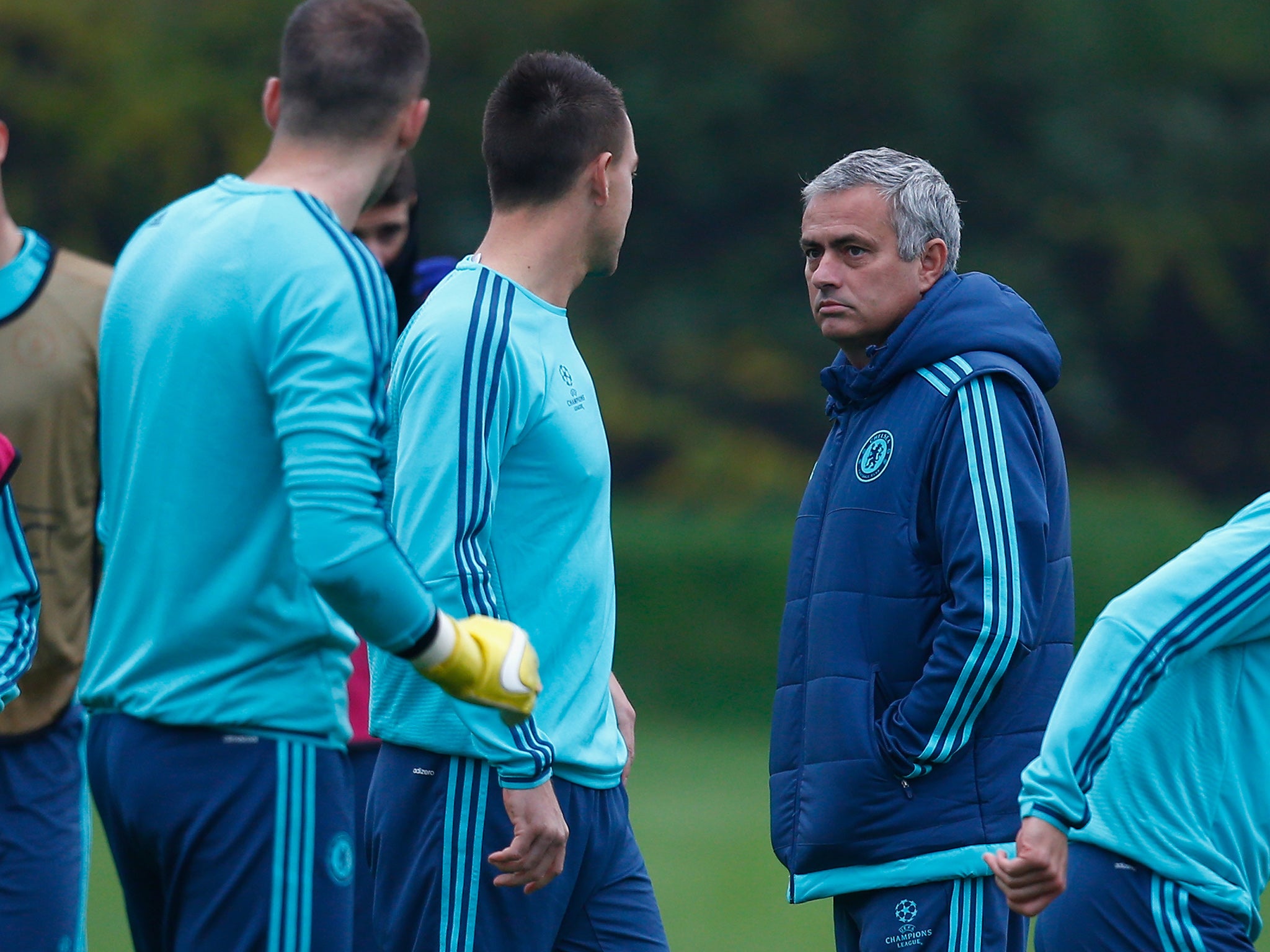 Jose Mourinho (right) looks at John Terry during training