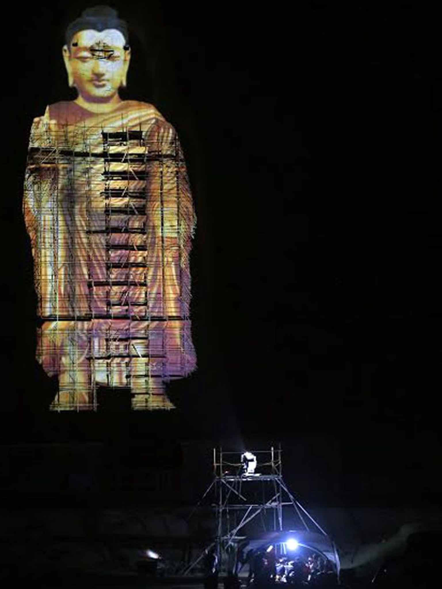 &#13;
Ancient and modern: a projected image of the site of a Buddha statue razed in 2001 from June this year&#13;