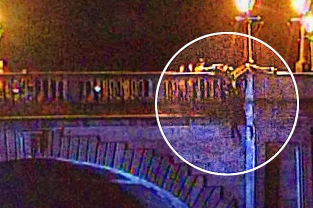 Police and firefighters came to the women's rescue when she was spotted sitting on the wrong side of the bridge ledge
