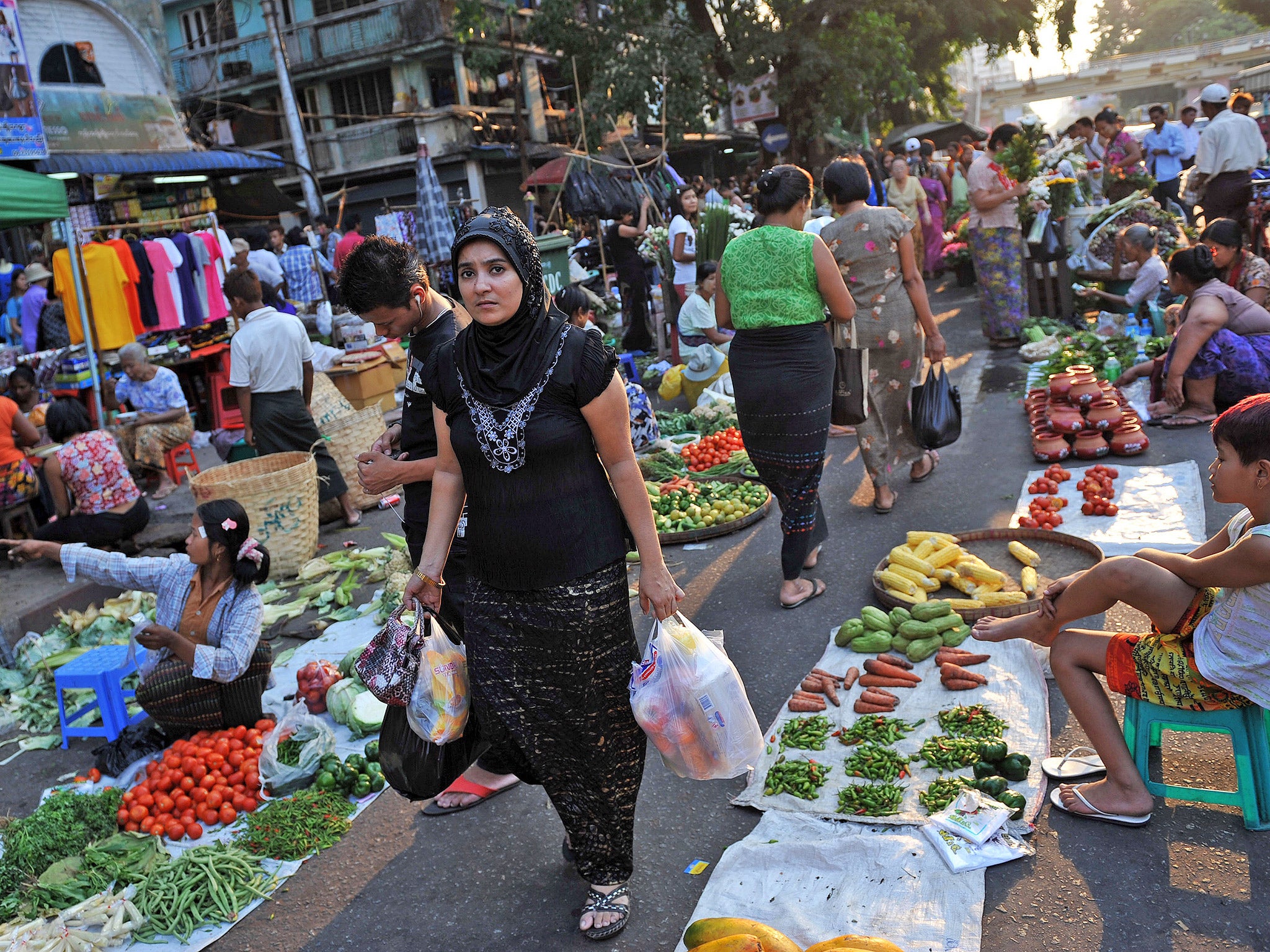 A Muslim woman shopping at a street market in Rangoon