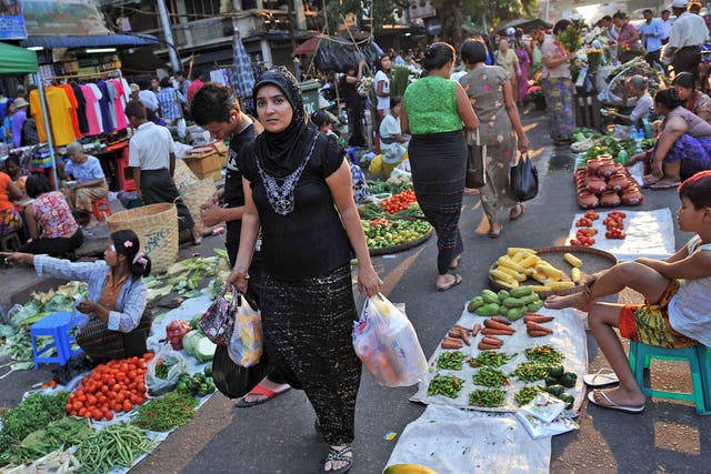 A Muslim woman shopping at a street market in Rangoon