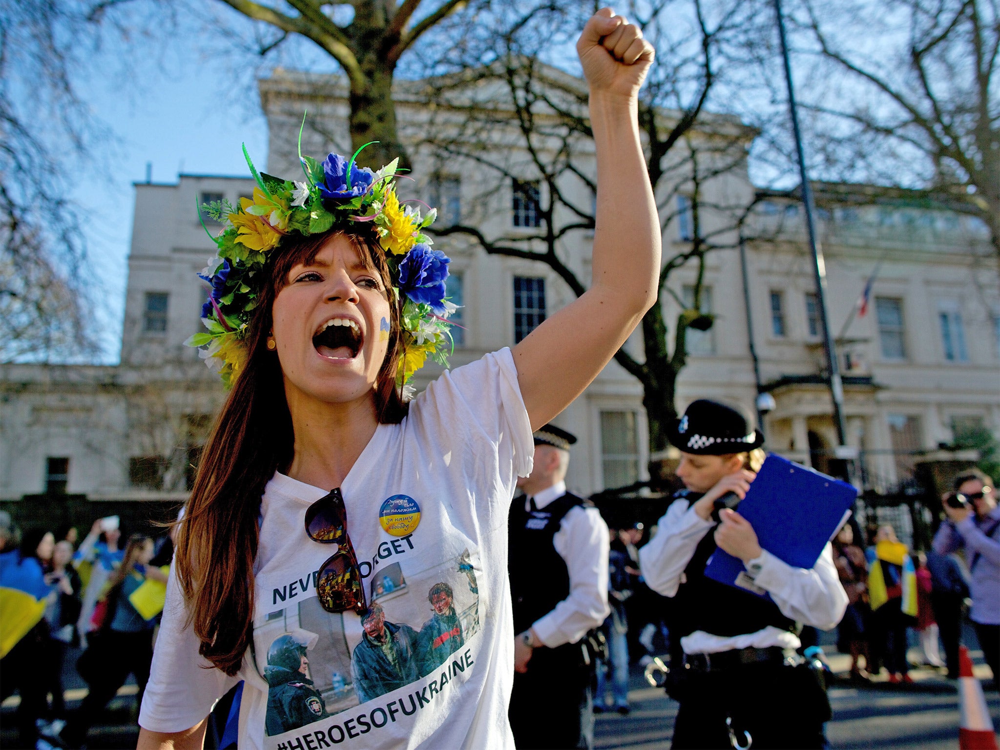 &#13;
A demonstrator takes part in a march outside the Russian embassy last year (Getty)&#13;