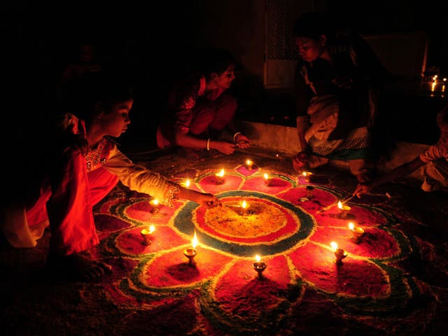 Pakistan's minority Hindu community decorate with earthen oil lamps as they celebrate Diwali, the Hindu Festival of Lights, in Lahore