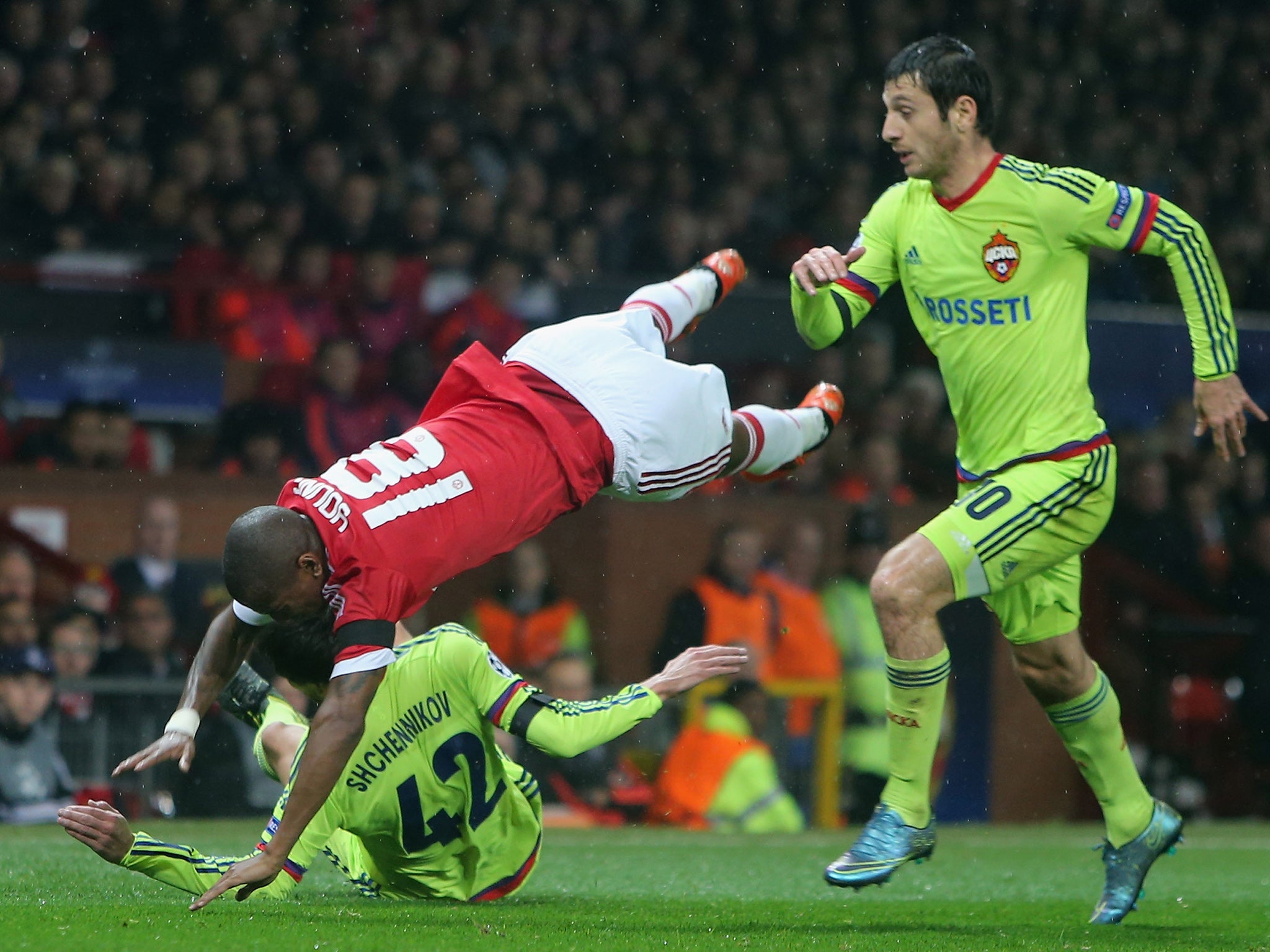 Manchester United winger Ashley Young goes over in a challenge against CSKA Moscow