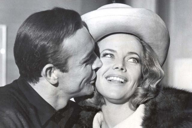 Sean Connery kisses Pussy Galore actress Honor Blackman on the cheek
