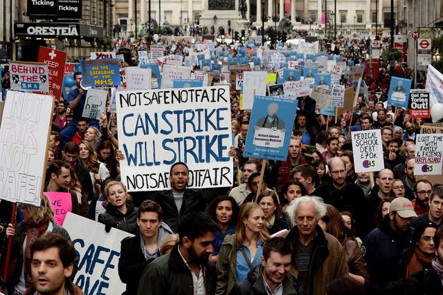 Demonstrators march down Whitehall during the 'Let's Save the NHS' protest by junior doctors in London last month