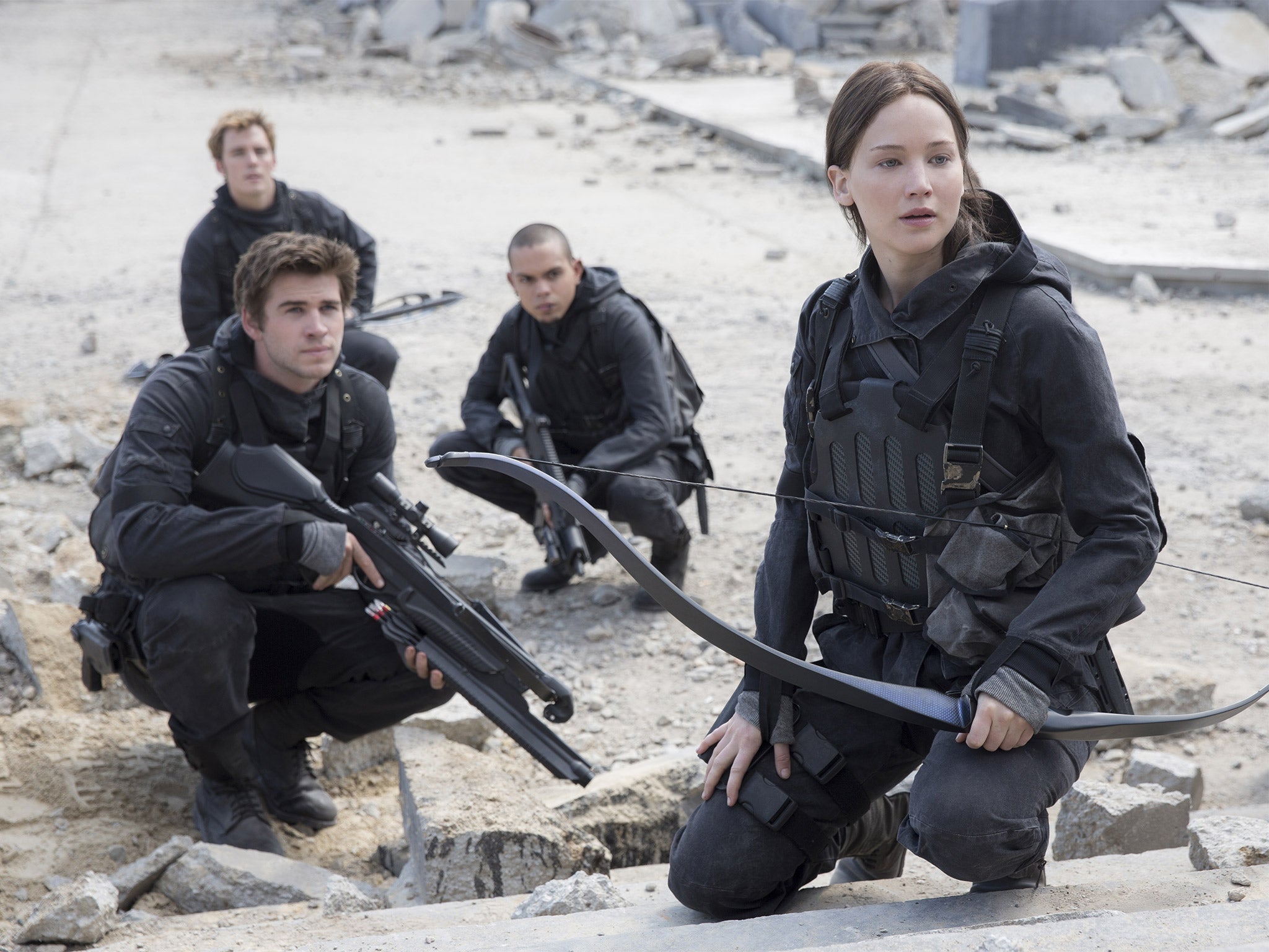 Jennifer Lawrence, right, reprises the role of Katniss Everdeen for the last time