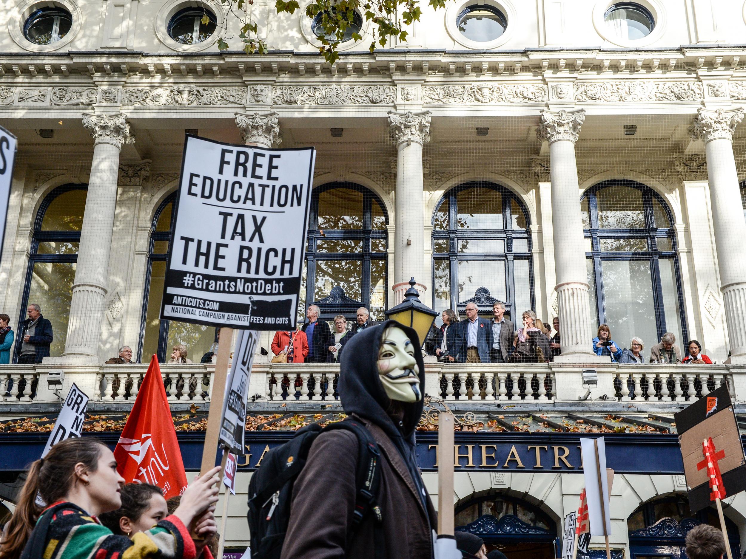 Demonstrators dispute the actions of Black Bloc anarchists after violence erupts