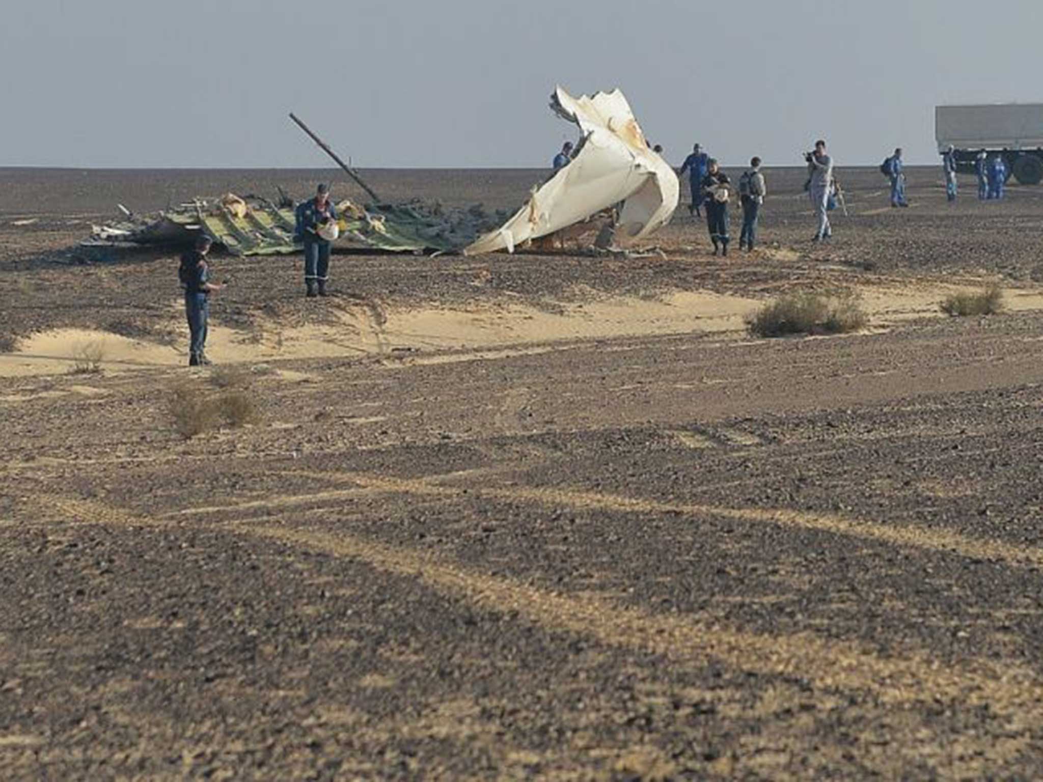 Russian emergency services personnel working at the crash site of the A321 airliner