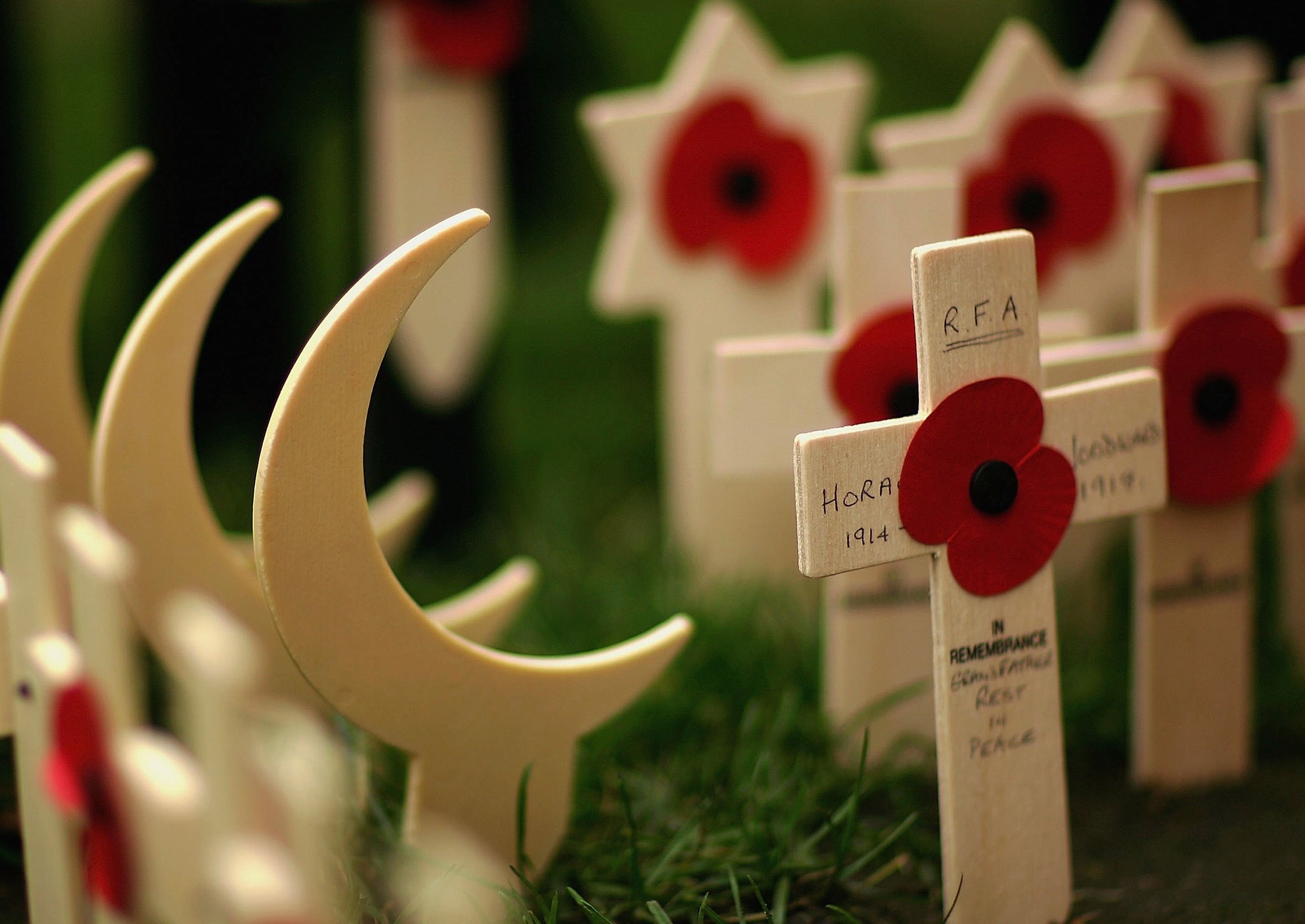 Wooden crescents represent Muslim soldiers in Westminster Abbey’s Royal British Legion Poppy Factory Field of Remembrance. The crescent of Islam doesn’t allow other symbols to be attached to it