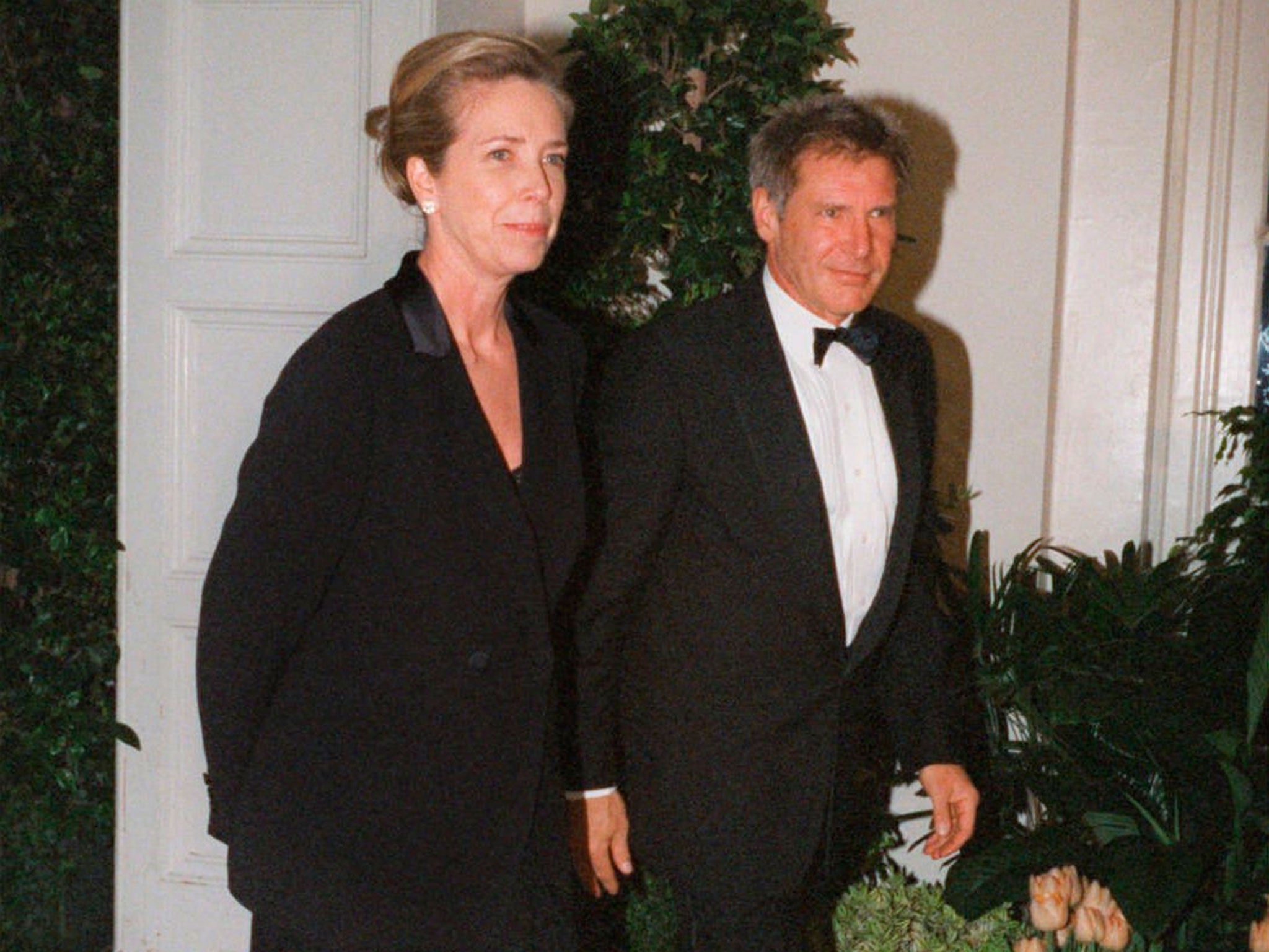 Mathison in 1998 with her then husband, Harrison Ford, arriving at a White House dinner for Tony Blair