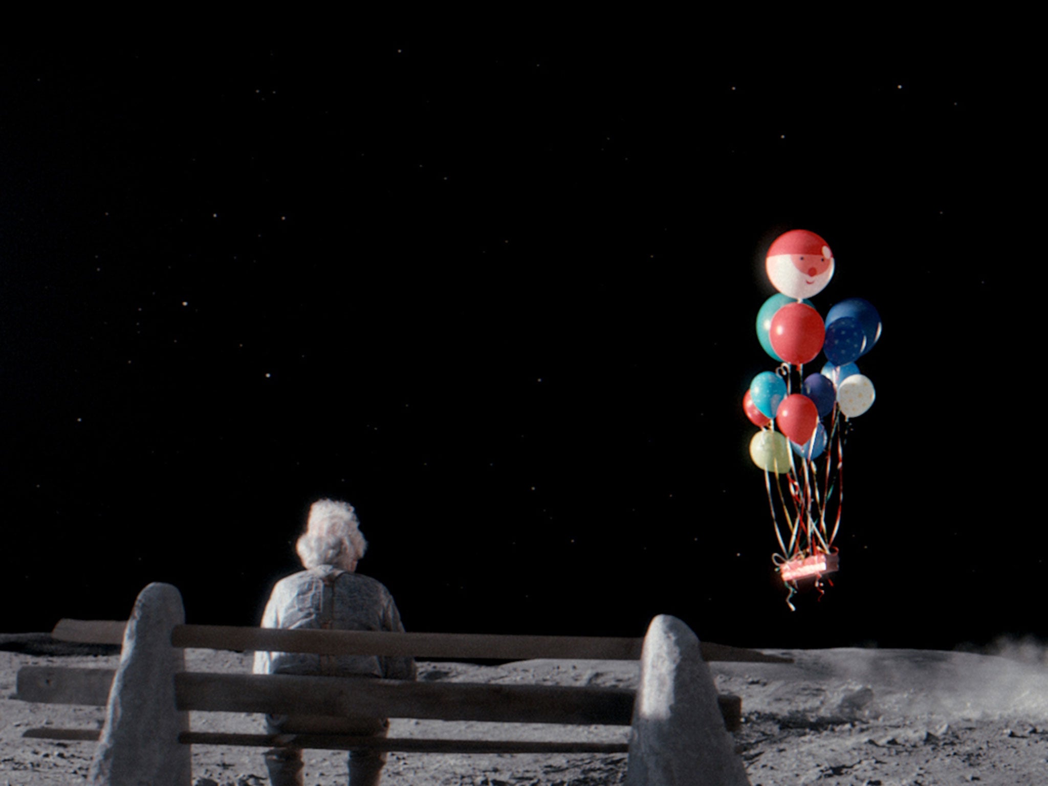 John Lewis's festive features a girl who sends a gift to an old man alone on the Moon (PA)