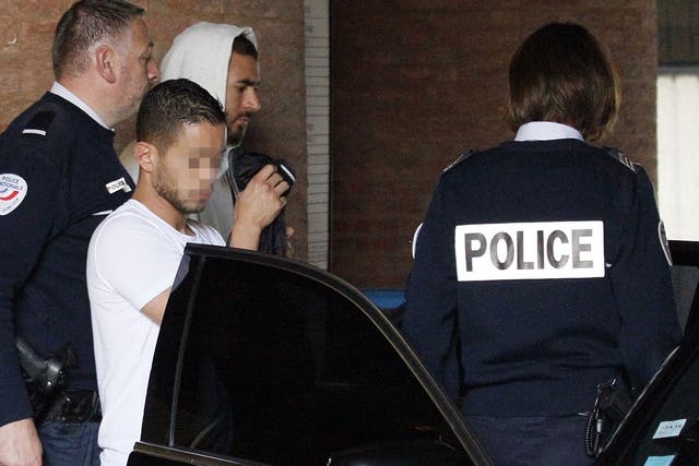 Real Madrid’s French striker Karim Benzema, second right, leaves the court house in Versailles