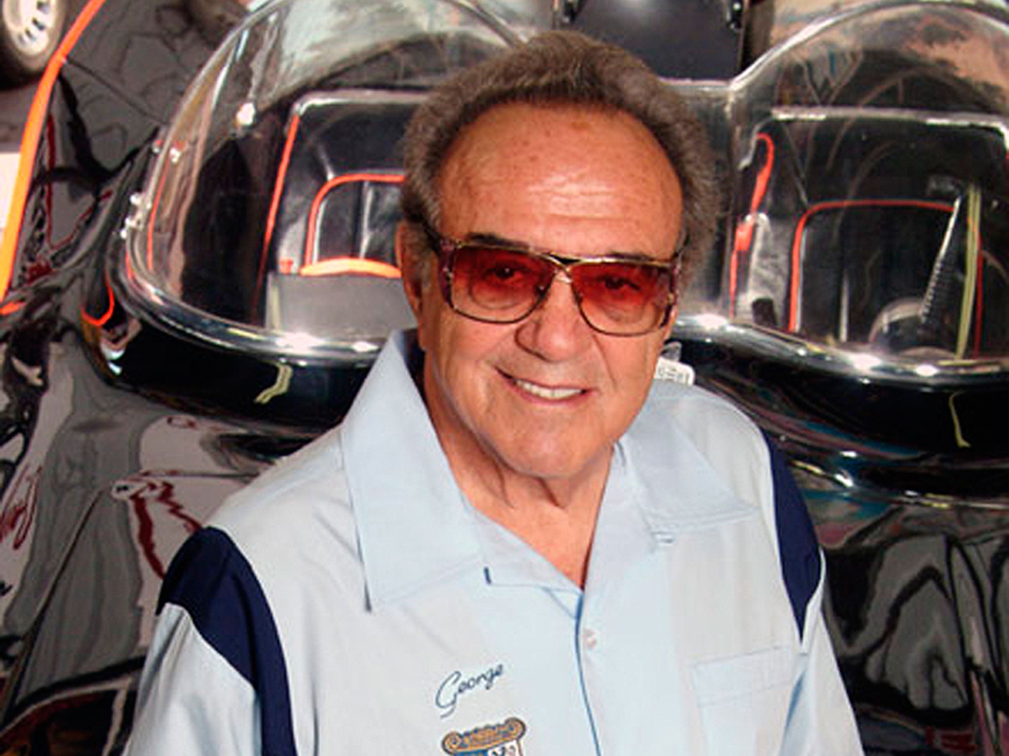 In this 2007 photo, George Barris stands by the 1966 Batmobile that he designed at Barris Kustom Studios in North Hollywood, Calif. Barris, who created television's original Batmobile, along with scores of other beautifully customized, instantly recognizable vehicles that helped define California car culture, has died at age 89