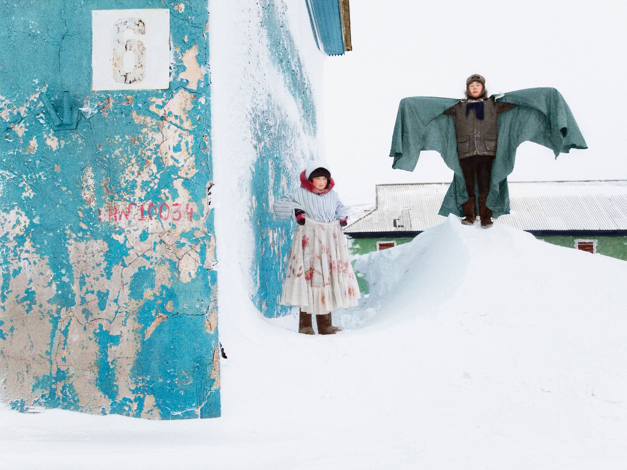 Tanya and her friend Pasha during Kolyada, a Russian ritual on Christmas Eve when people dress up and go from door to door singing and dancing for treats