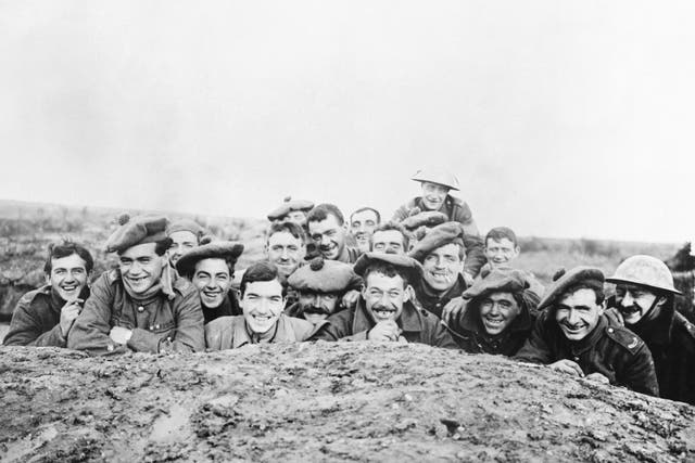 Gordon Highlanders smile for the camera from a reserve trench, 1916