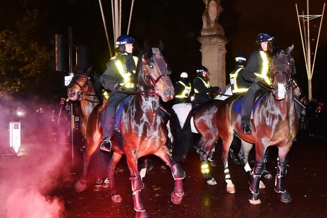Protesters let off flares near police horses outside St James Park. One police horse is said to have bolted when an explosive flew past its head.