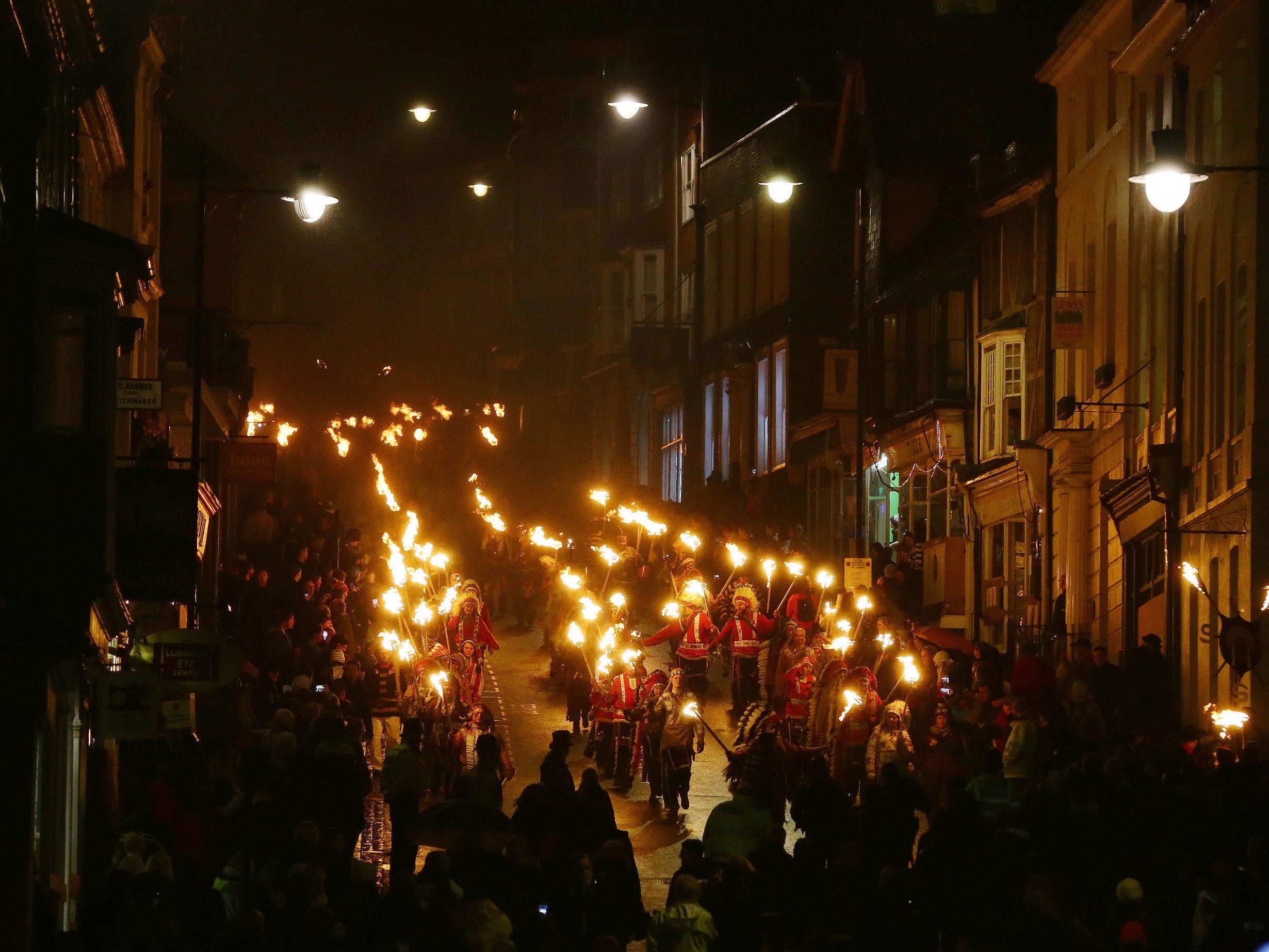 Participants parading through the town of Lewes in East Sussex PA