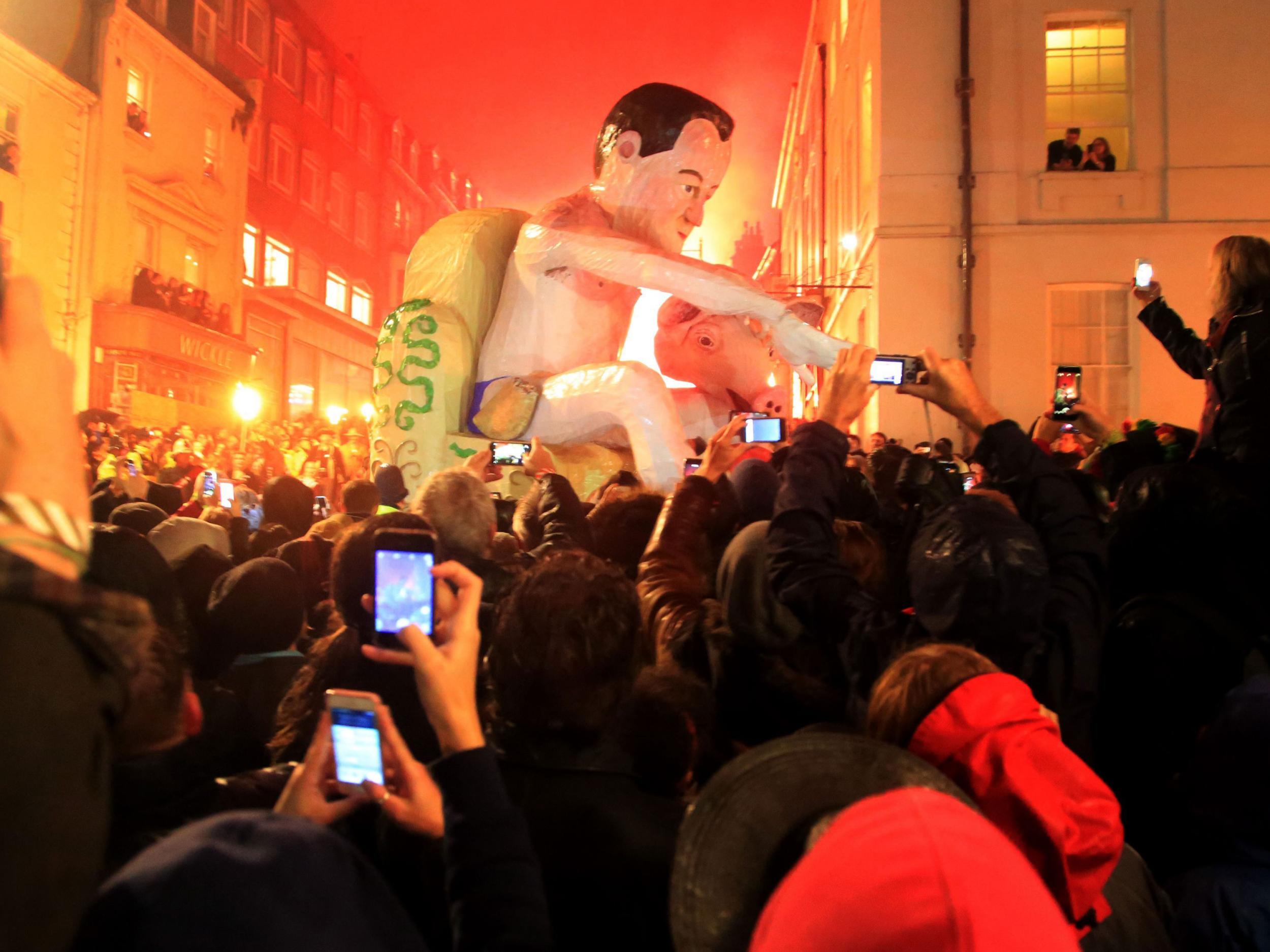 An effigy of Prime Minister David Cameron is paraded through the town of Lewes PA